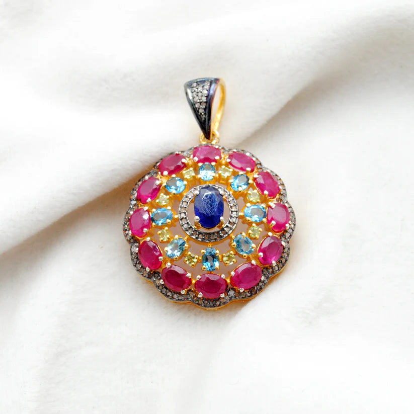 925 sterling silver pendant with pave-set diamonds, featuring vibrant ruby, blue topaz, sapphire, and peridot gemstones in an elegant design