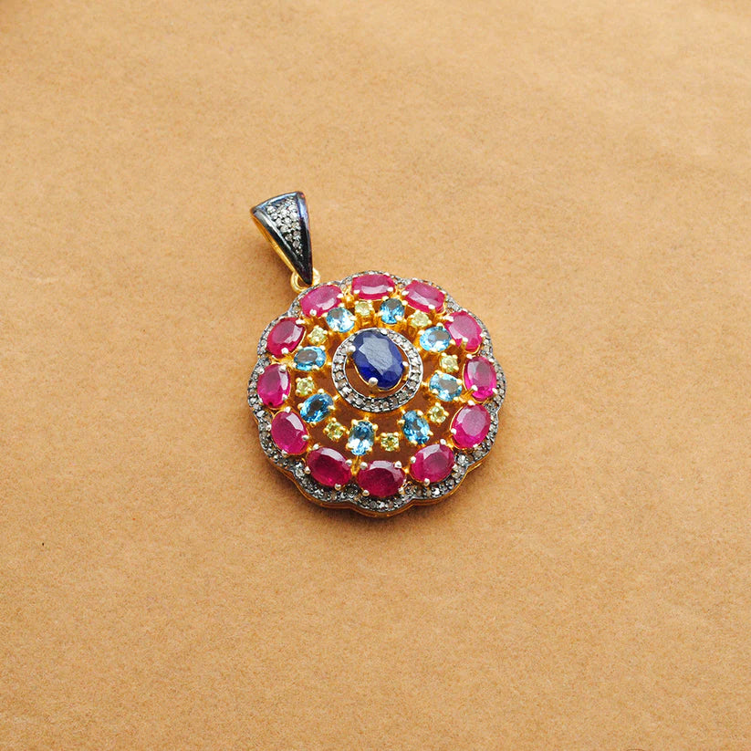 925 sterling silver pendant with pave-set diamonds, featuring vibrant ruby, blue topaz, sapphire, and peridot gemstones in an elegant design
