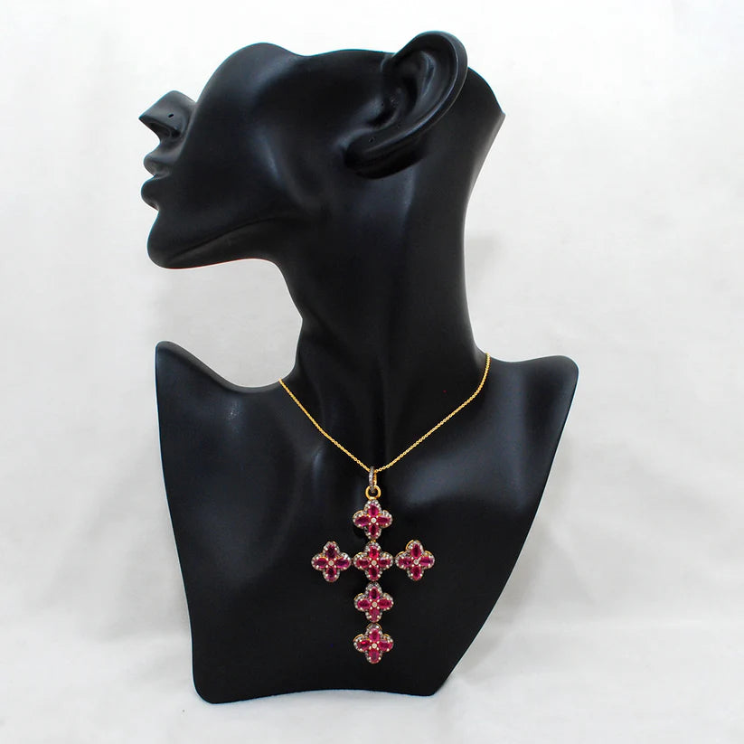 Gold-plated sterling silver pendant featuring a vivid ruby centerpiece surrounded by sparkling pavé-set diamonds in an elegant design