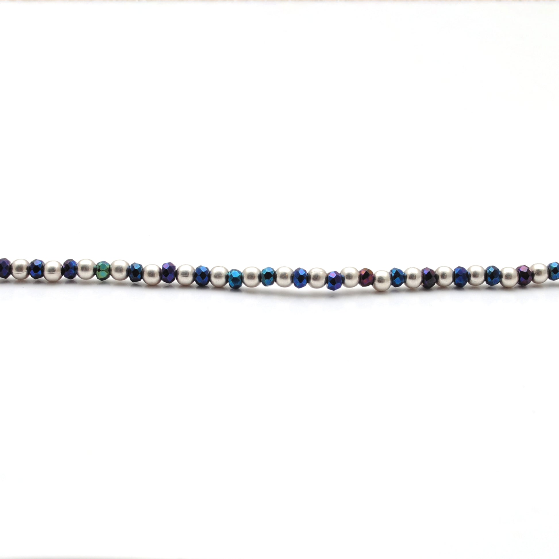 "Blue mystic coated faceted beaded necklace with silver clasp, iridescent shimmering gemstone jewelry, handcrafted design."