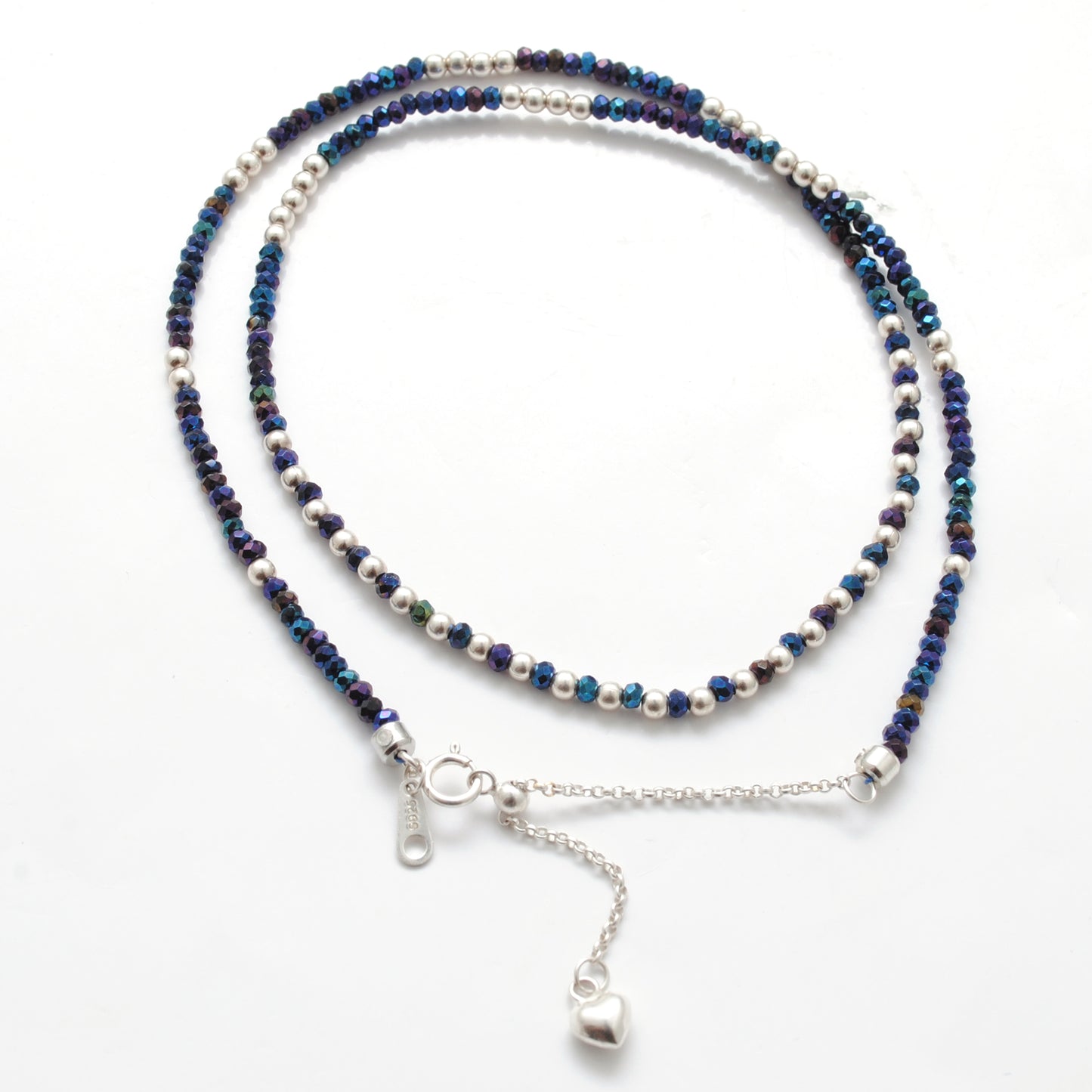 "Blue mystic coated faceted beaded necklace with silver clasp, iridescent shimmering gemstone jewelry, handcrafted design."