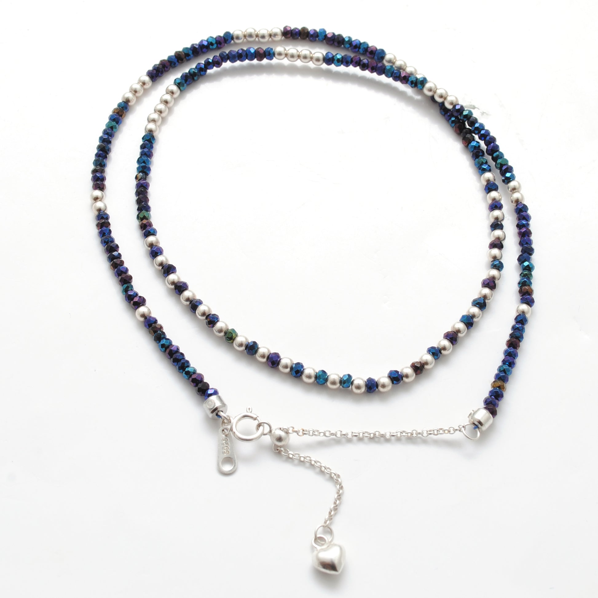 "Blue mystic coated faceted beaded necklace with silver clasp, iridescent shimmering gemstone jewelry, handcrafted design."