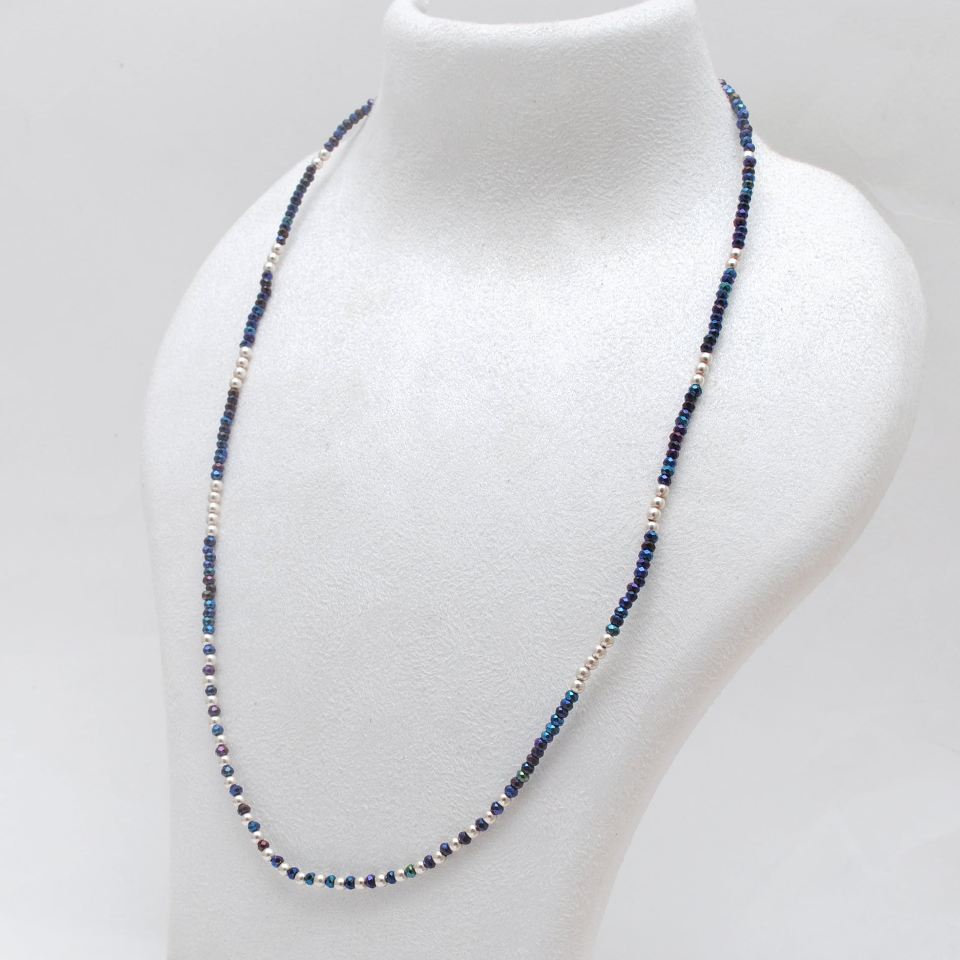 "Blue mystic coated faceted beaded necklace with silver clasp, iridescent shimmering gemstone jewelry, handcrafted design."