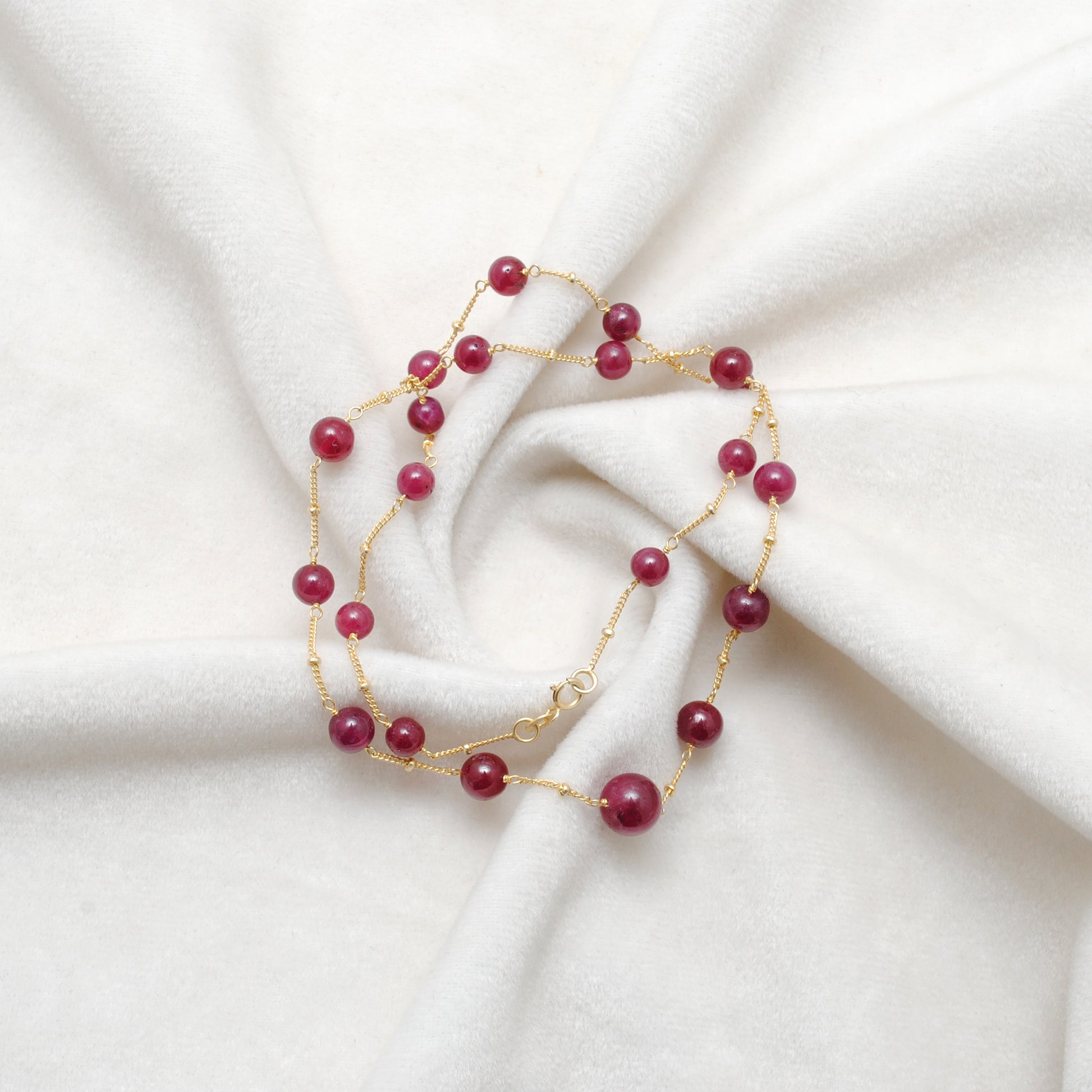 "Natural ruby ball bead necklace with sterling silver clasp, deep red gemstone jewelry, handcrafted elegant design."