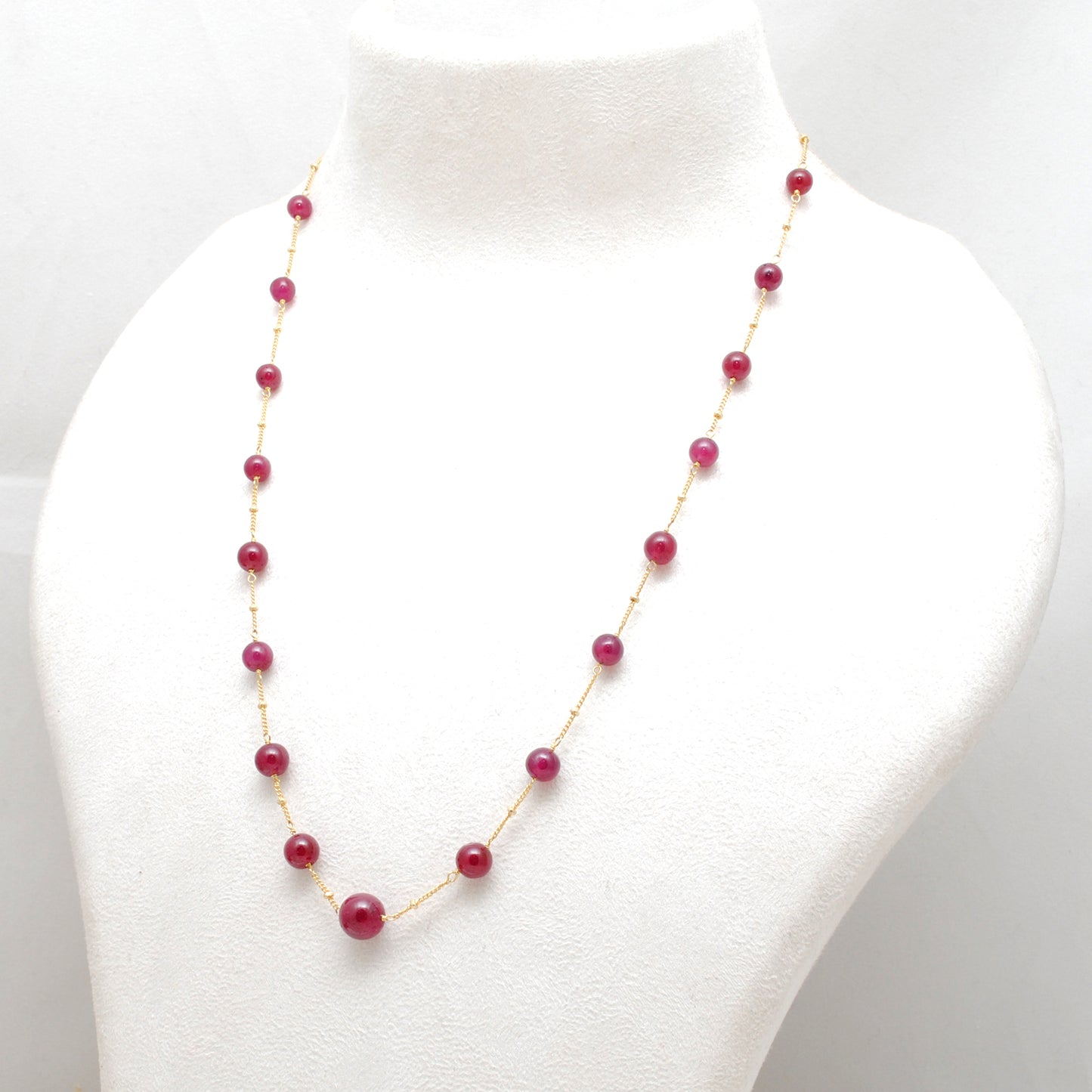 "Natural ruby ball bead necklace with sterling silver clasp, deep red gemstone jewelry, handcrafted elegant design."
