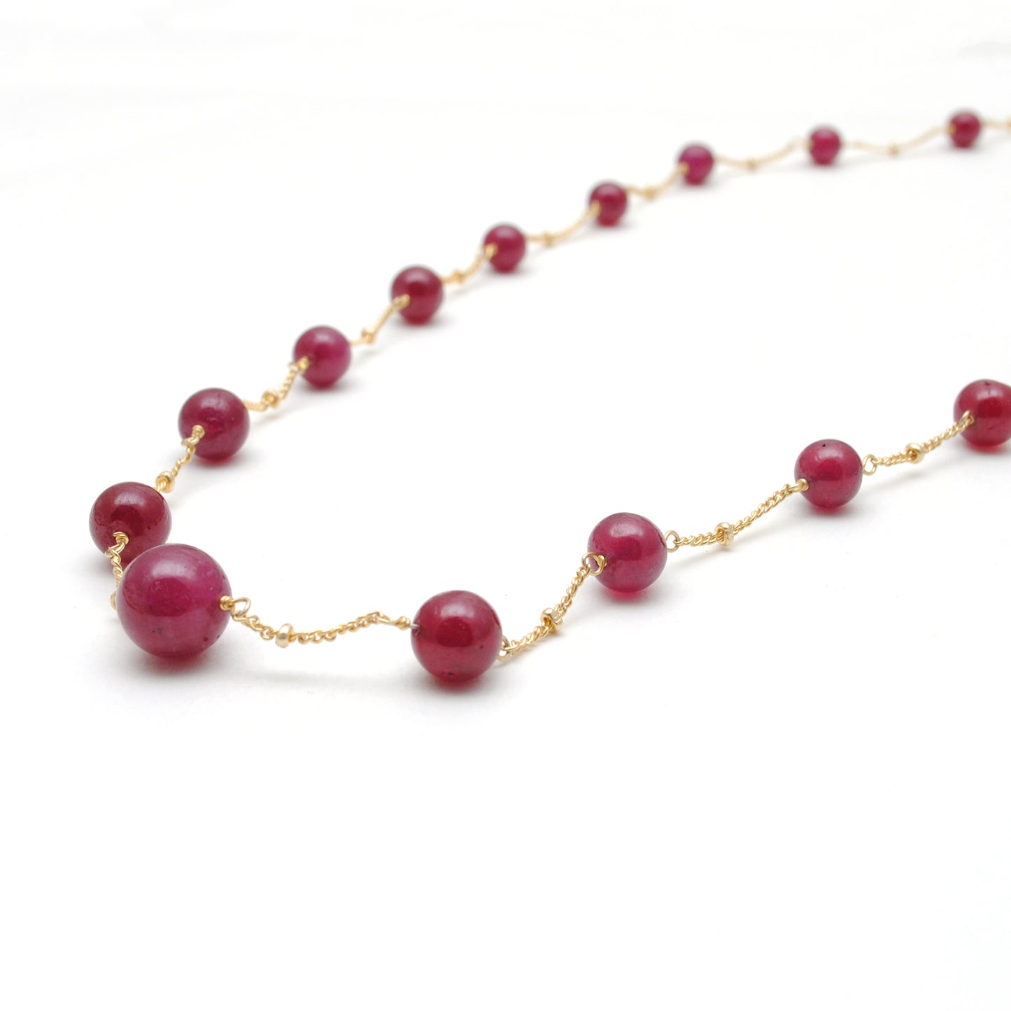"Natural ruby ball bead necklace with sterling silver clasp, deep red gemstone jewelry, handcrafted elegant design."