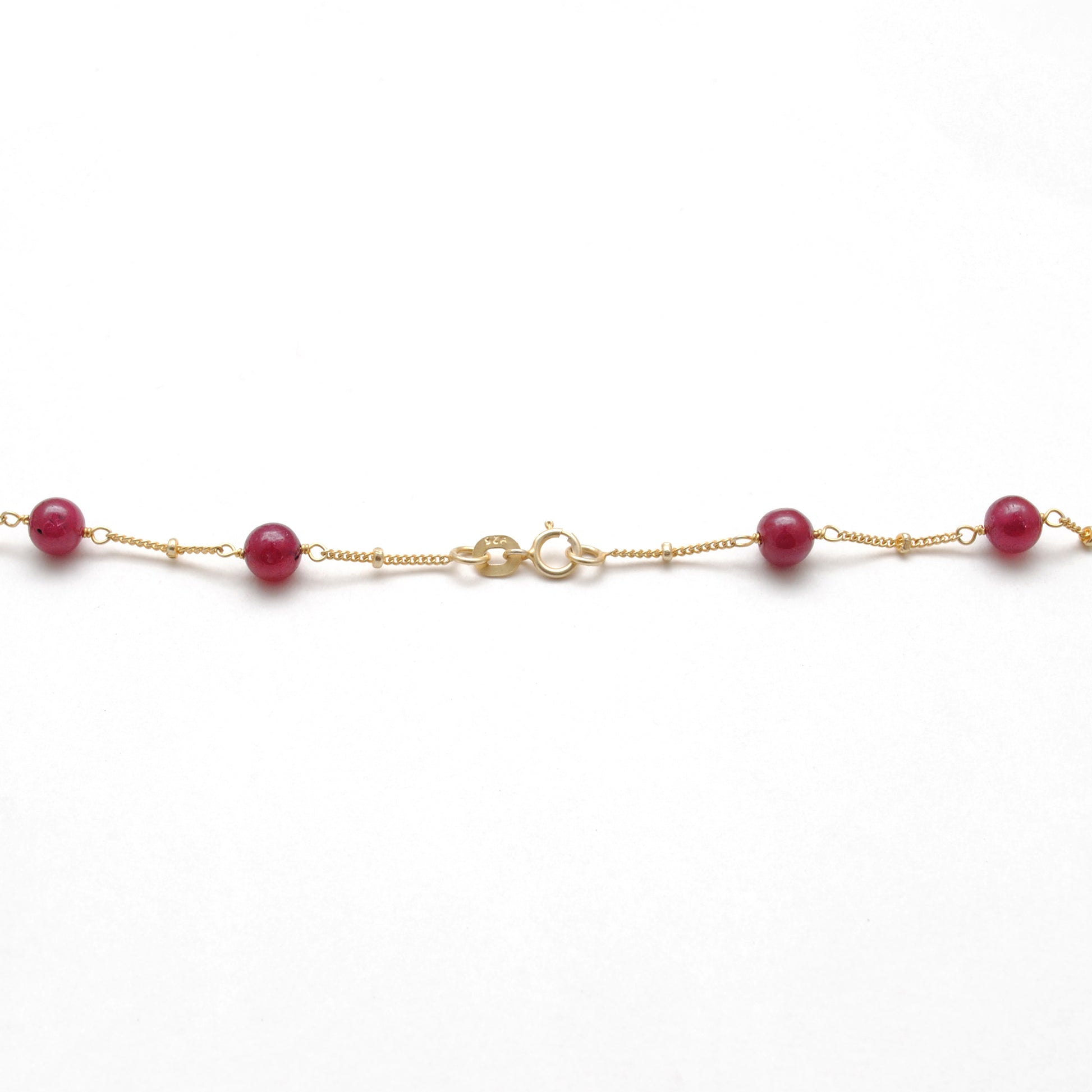 "Natural ruby ball bead necklace with sterling silver clasp, deep red gemstone jewelry, handcrafted elegant design."