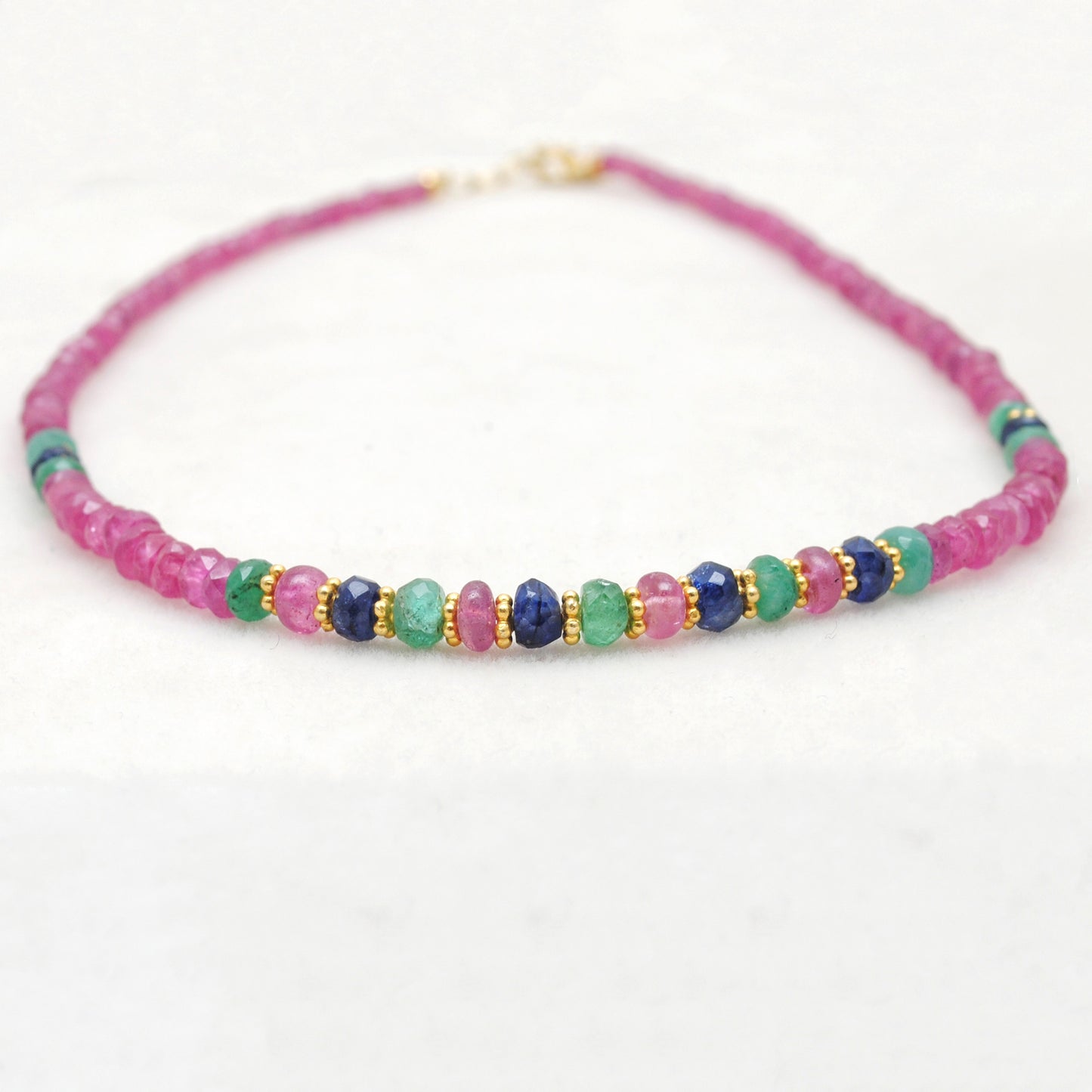 Ruby, emerald and sapphire beaded gold plated necklace with multicolor gemstones and elegant design