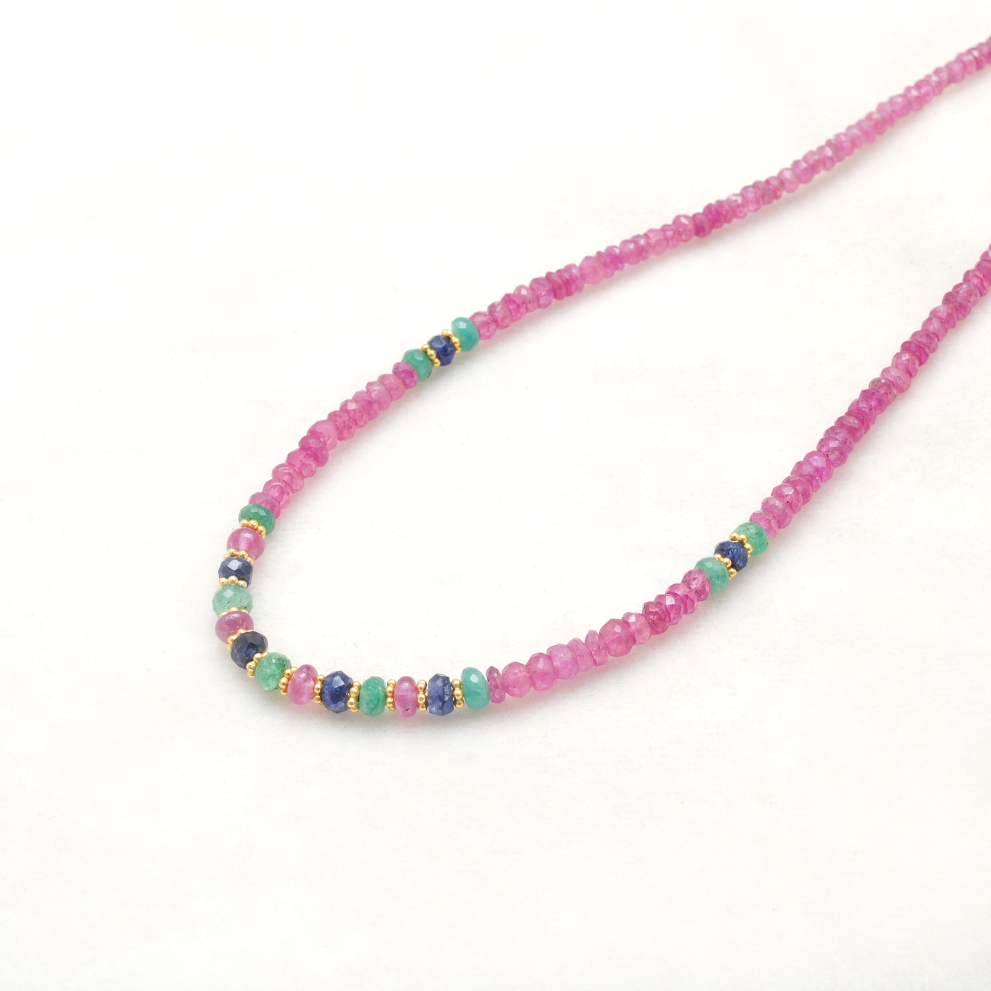 Ruby, emerald and sapphire beaded gold plated necklace with multicolor gemstones and elegant design