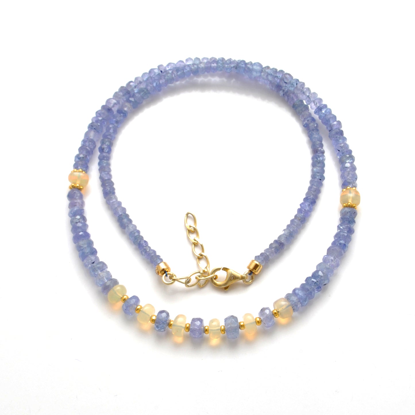 "Faceted tanzanite and Ethiopian opal beaded necklace with gold-plated finish, iridescent gemstone jewelry."