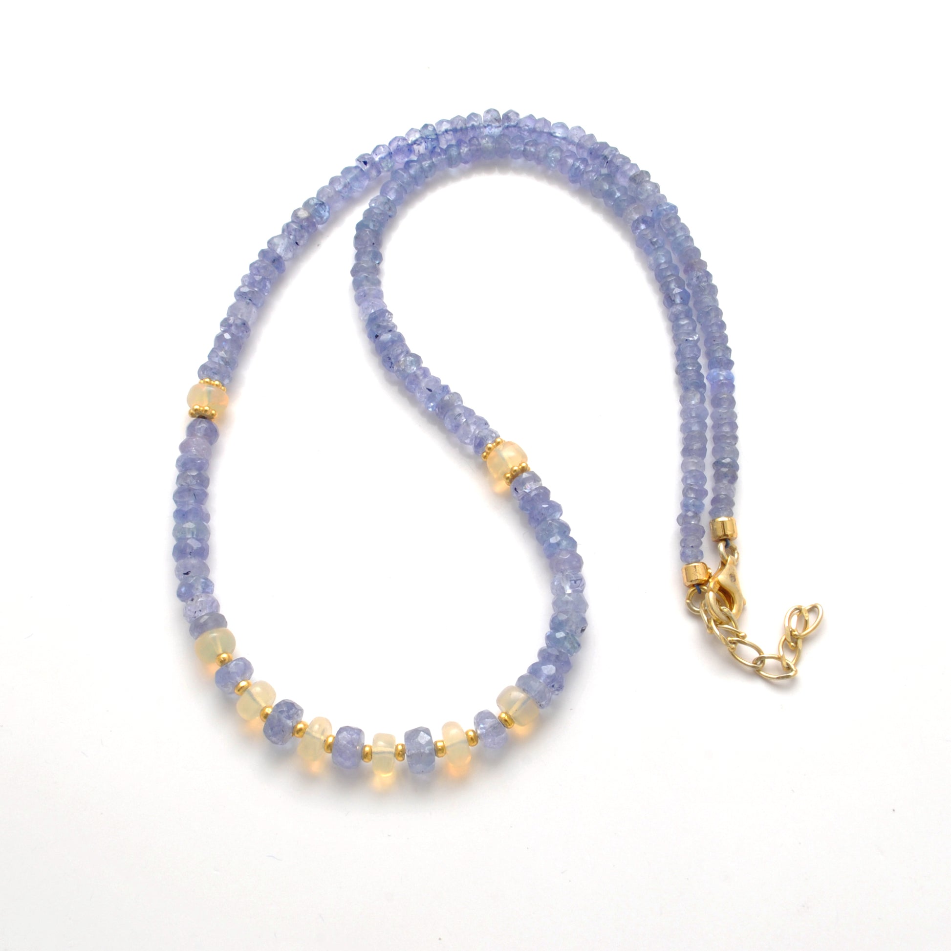 "Faceted tanzanite and Ethiopian opal beaded necklace with gold-plated finish, iridescent gemstone jewelry."
