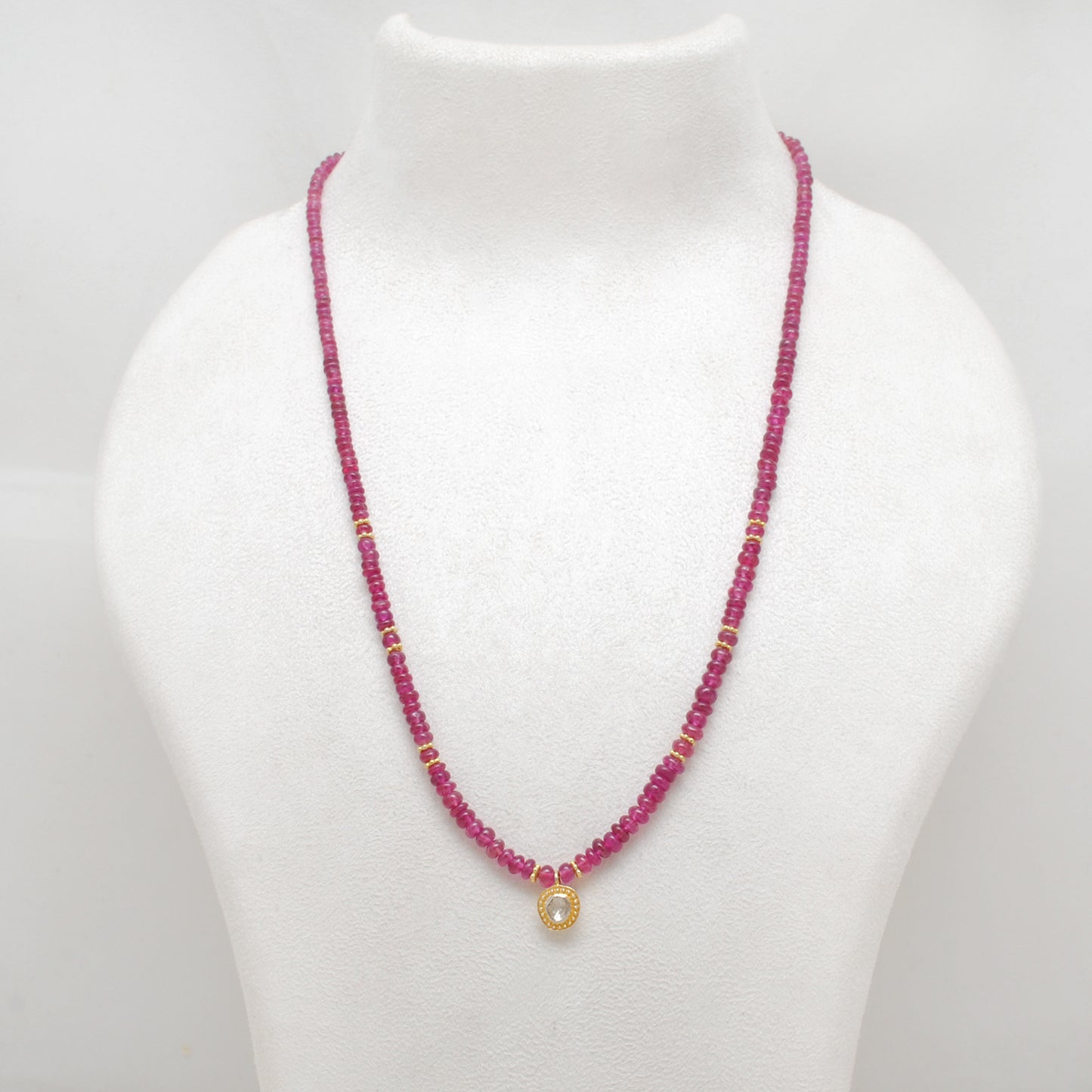 "Natural ruby beaded necklace with rose-cut diamond charm and sterling silver clasp, handcrafted jewelry with deep red gemstones for women."