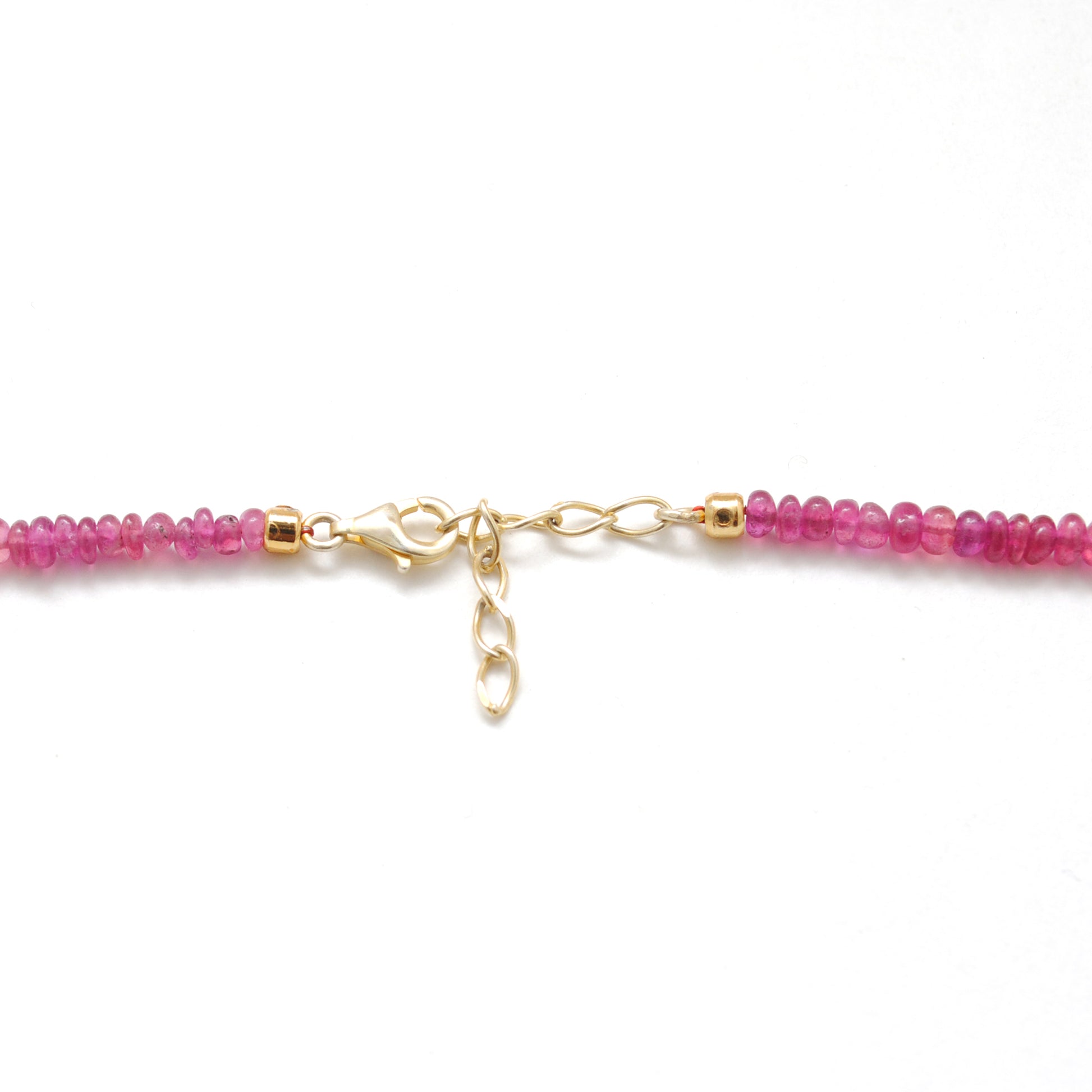 "Natural ruby beaded necklace with rose-cut diamond charm and sterling silver clasp, handcrafted jewelry with deep red gemstones for women."