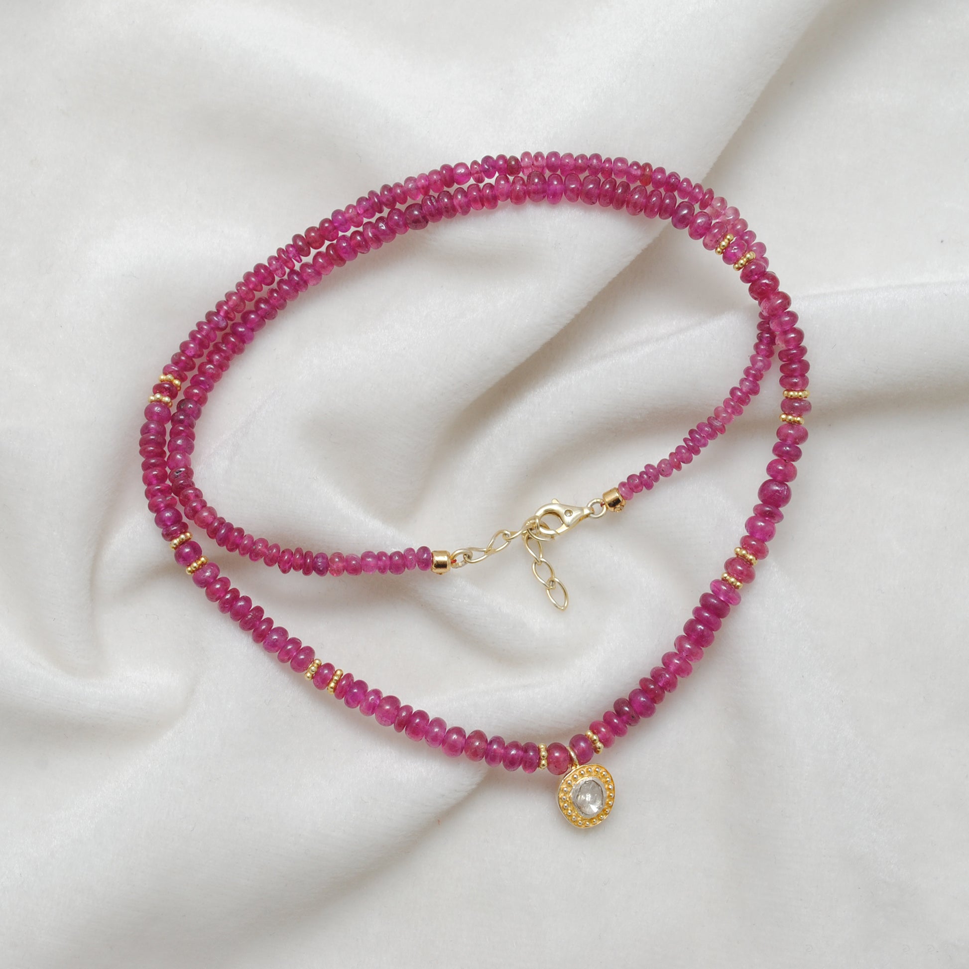 "Natural ruby beaded necklace with rose-cut diamond charm and sterling silver clasp, handcrafted jewelry with deep red gemstones for women."