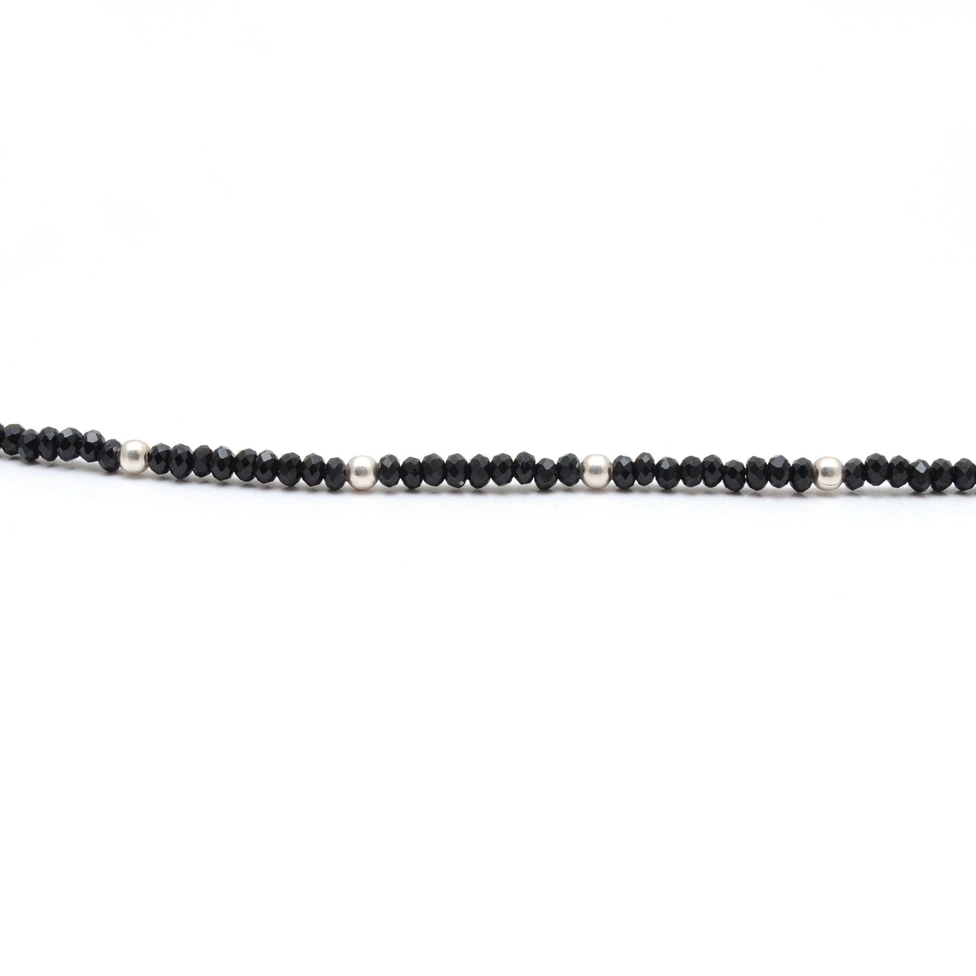 "Handmade black spinel beaded necklace with sterling silver clasp, faceted dark gemstone jewelry with subtle sparkle."