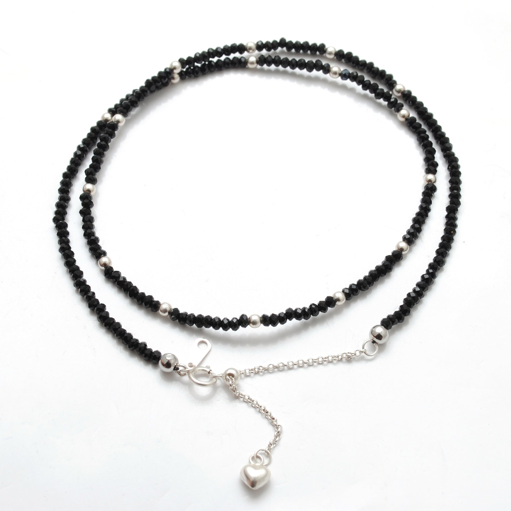 "Handmade black spinel beaded necklace with sterling silver clasp, faceted dark gemstone jewelry with subtle sparkle."