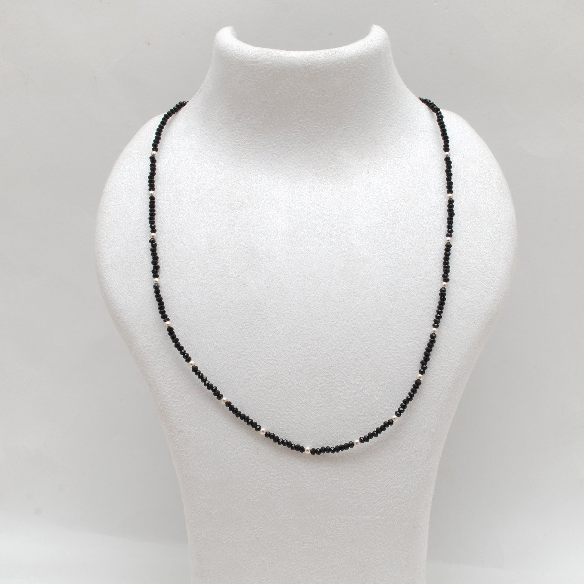 "Handmade black spinel beaded necklace with sterling silver clasp, faceted dark gemstone jewelry with subtle sparkle."